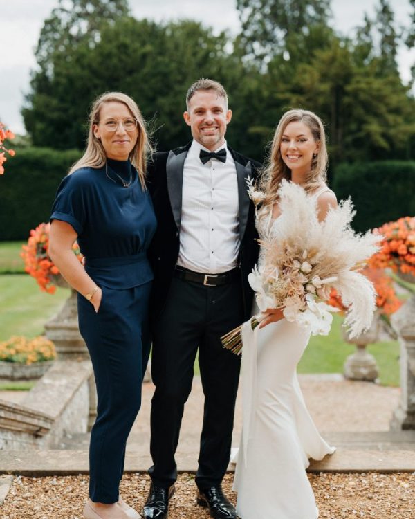 Olivia with newlywed couple, Heather & Steve